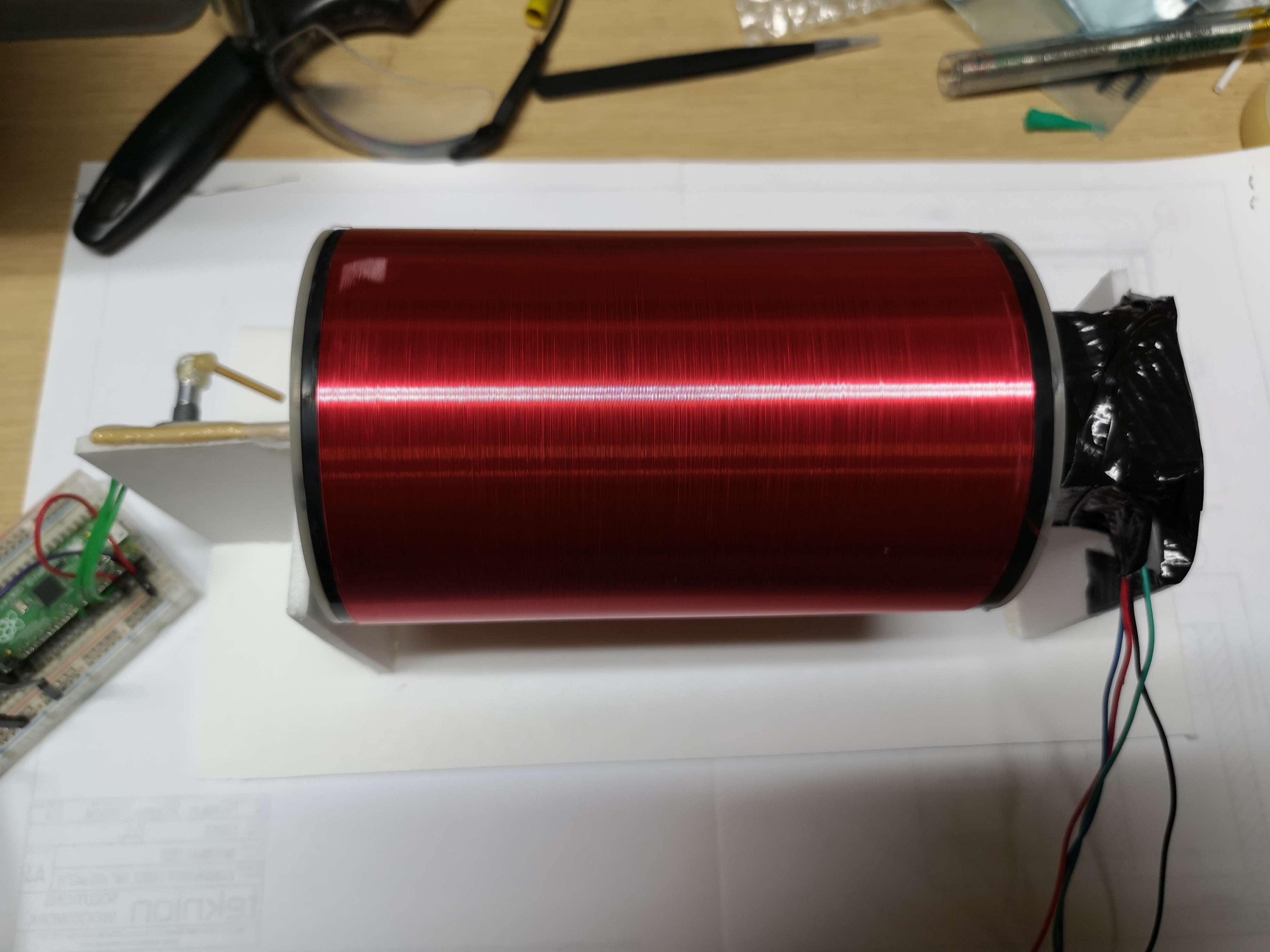 fully wound secondary coil, with epoxy coating on the winding rig